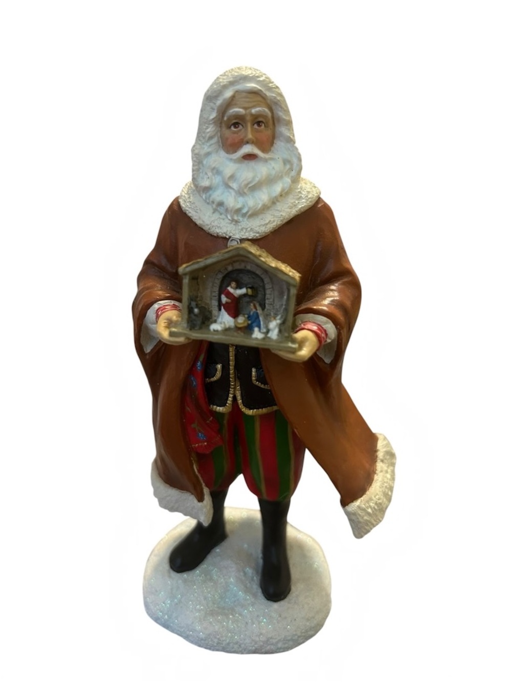 Santa Claus Poland holding Nativity scene figurine